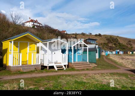 Wooden beach huts at Coldingham Bay in Berwickshire, Scottish Borders, Scotland, United Kingdom Stock Photo