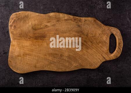 Empty cutting board on black background. Top view Stock Photo