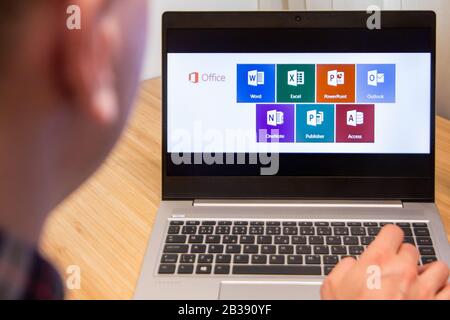 Office 365 is used by a man on the laptop. Microsoft customer used computer software. New product is tested by IT specialist. San Francisco, February Stock Photo