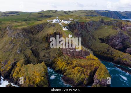 Aerial view of St Abbs Head with lighthouse in Scottish Borders, Scotland, UK Stock Photo