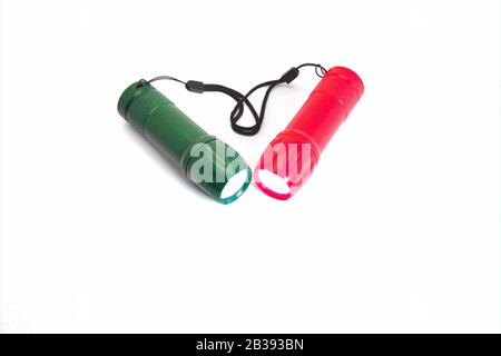 Portable LED flashlights red and green color isolate on a white background. Stock Photo
