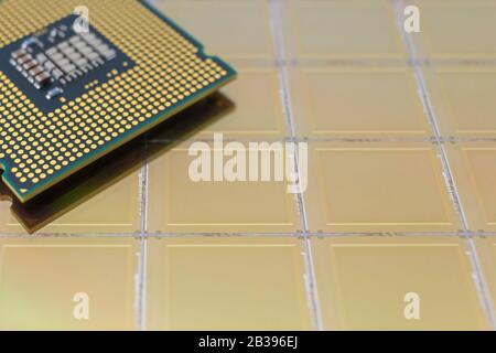Computer CPU processor chip on yellow surface of slicion wafer chip background Stock Photo