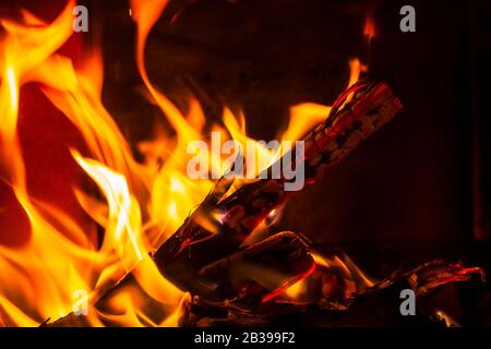 Glowing Hot Charcoal Briquettes Close-up Background Texture Stock Photo