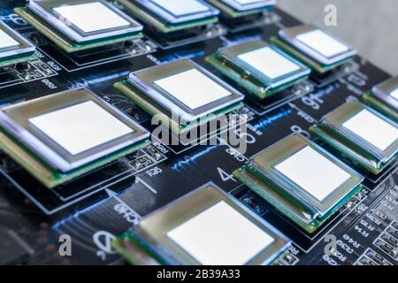 Test several oled displays of white color on the test station. Displays glow brightly of white color close up. Stock Photo
