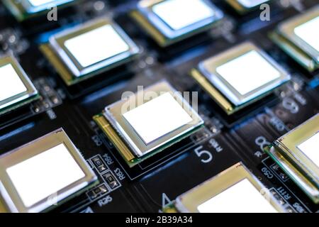 Test several oled displays of white color on the test station. Displays glow brightly of white color close up. Stock Photo
