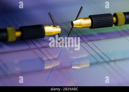 Manual probe system with needles for test of semiconductor on silicon wafer. Selective focus. Stock Photo