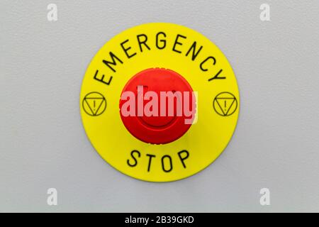 Press the machine red emergency stop button Stock Photo