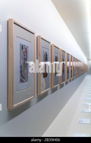 frames with unreadable pictures on brick white wall Stock Photo