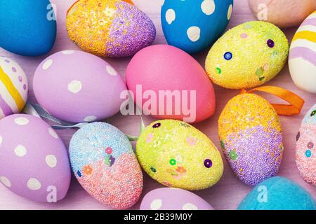 Easter eggs decorated in various colors. Festive background Stock Photo