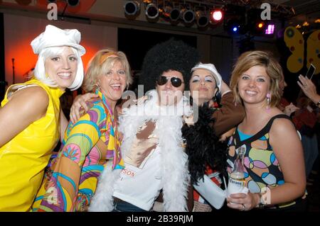 San Antonio, TX  May, 2004: Trade association convention attendees dress up in costumes for 1960s-themed reception. ©Bob Daemmrich Stock Photo