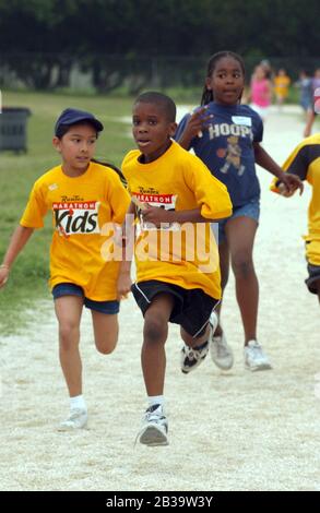 Austin Texas USA, circa 2004: Third-grade boys compete in mile run during track and field day at their elementary school. ©Bob Daemmrich Stock Photo