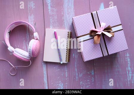 pink color gift box and notepad on table  Stock Photo