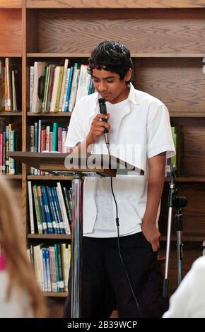 Austin, Texas USA, circa 2004:: 7th grade boy competes in first 'Poetry Slam' at Fulmore Junior High School library. ©Bob Daemmrich Stock Photo