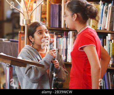 Austin Texas USA, circa 2004: 7th graders in first-annual "Poetry Slam" at Fulmore Junior High School in the school library.  ©Bob Daemmrich Stock Photo