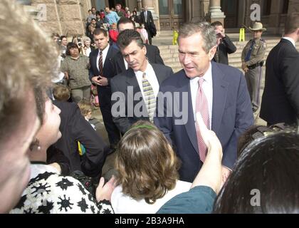 Austin, Texas USA, Dec. 11 2000:  Texas Governor and possible U.S. president-elect George W. Bush greets well-wishers outside the Texas Capitol after working in his office and keeping an eye on the Supreme Court case that will decide the Florida recount. ©Bob Daemmrich Stock Photo