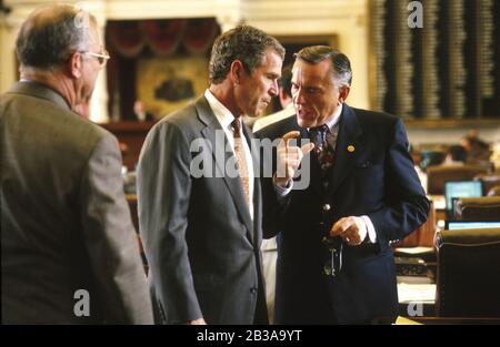 Austin, Texas USA, 1997: Texas Governor George W. Bush meeting with House member Gene Seaman at the Texas Capitol during the 1997 session of the Texas Legislature. ©Bob Daemmrich Stock Photo