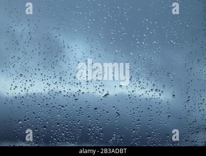 Drops of water on glass after rain, panorama photo. Stock photo for wallpaper and background, with empty space for text and design Stock Photo