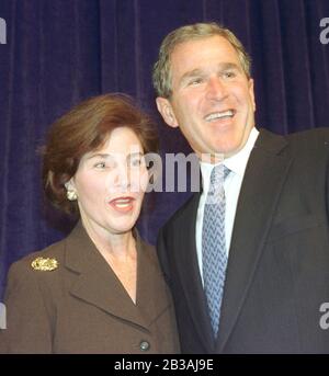 Austin, Texas USA, 04 NOV 1998: BIRTHDAY GIRL:  First Lady Laura Bush and Governor George W. Bush smile at photographers after a reporter wished her 'happy birthday' Wednesday following Bush's re-election to a second term as governor of Texas.  Mrs. Bush turned 52 today. ©Bob Daemmrich Stock Photo