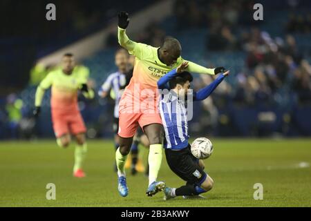 SHEFFIELD, ENGLAND - MARCH 4TH Manchester City's Benjamin Mendy battles with Sheffield Wednesday's Fernando Forestieri during the FA Cup Fifth Road match between Sheffield Wednesday and Manchester City at Hillsborough, Sheffield on Wednesday 4th March 2020. (Credit: Mark Fletcher | MI News) Photograph may only be used for newspaper and/or magazine editorial purposes, license required for commercial use Credit: MI News & Sport /Alamy Live News Stock Photo