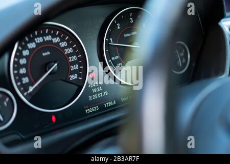 BMW series 7 dashboard instrument cluster, speedometer, hand brake icon, turometer, fuel level Stock Photo