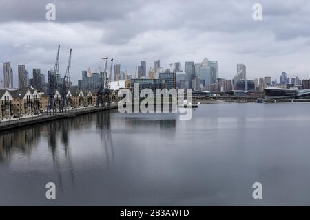 London, Britain. 4th Mar, 2020. Canary Wharf financial district and the City of London are seen from Royal Victoria Dock, in London, Britain, on March 4, 2020. The impact of coronavirus on British economy could 'prove large but will ultimately be temporary', Mark Carney, governor of Bank of England (BoE) said Tuesday. Credit: Tim Ireland/Xinhua/Alamy Live News Stock Photo