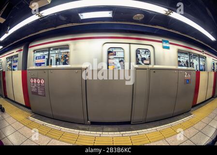 Tokyo subway train arriving at Shinjuku station. Stock Photo
