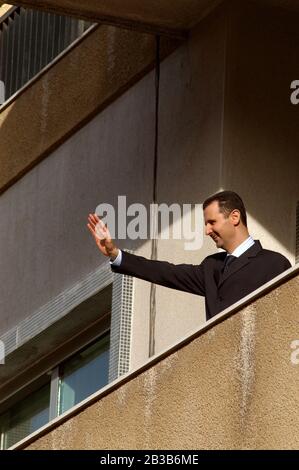 March 9th 2005 Damascus, Syria. The Syrian President Bashar al Assad waves to his supporters during a pro government demonstration in the center of Da Stock Photo
