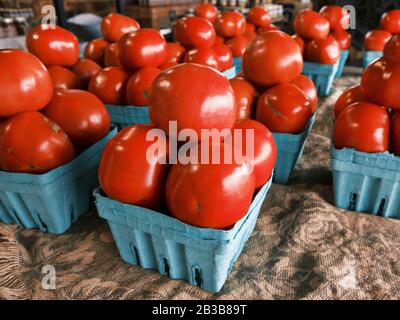 Farm fresh beefsteak tomatoes on display for sale in a rural Alabama farmer's market or roadside market in Pike Road Alabama, USA. Stock Photo