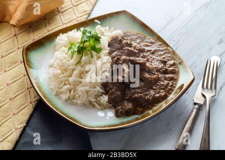 Indian boti liver curry made with chicken offal giblets with basmati rice Stock Photo