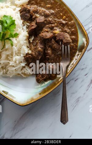 Indian boti liver curry made with chicken offal giblets with basmati rice Stock Photo