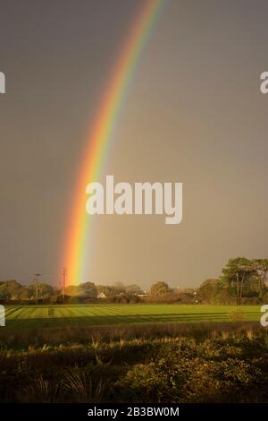 Double rainbow over fields. Hayling Island, Hampshire Stock Photo