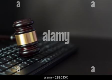 Judge's gavel on computer keyboard with copy space Stock Photo