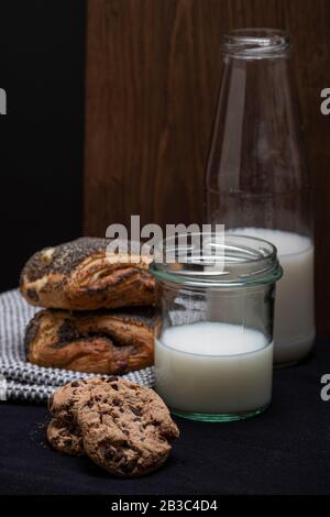 Milk pastry and cookies dinner food composition, non diary milk. Delicious beautiful stock photography. Sweet sugary meals. Desert on a table. Stock Photo