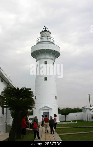 Pingtung, JUN 12: Overcast view of the Eluanbi lighthouse on JUN 12, 2004 at Kenting, Pingtung, Taiwan Stock Photo