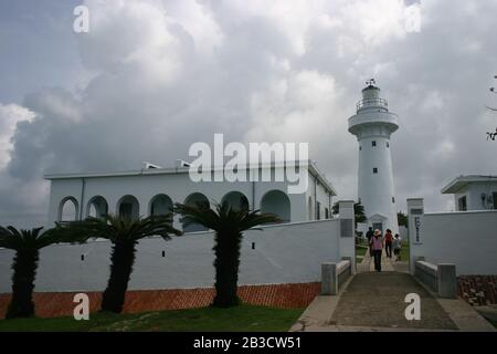 Pingtung, JUL 5: Overcast view of the Eluanbi lighthouse on JUL 5, 2004 at Kenting, Pingtung, Taiwan Stock Photo