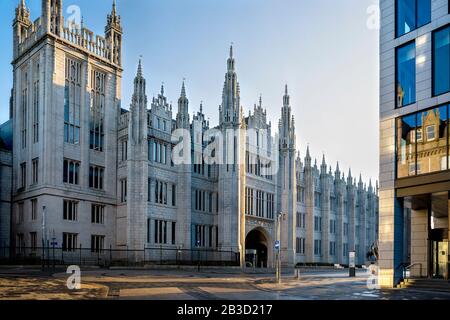 The Facade of Marischal College in Aberdeen, Scotland, bathed in the early morning light. Seen from the corner between Upperkirkgate and Broad Street. Stock Photo