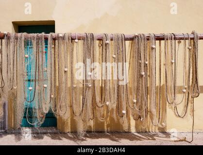 Fishing nets hung up to dry, Baska, Island of Krk, Kvarner Gulf Bay, Croatian Adriatic Coast, Croatia Stock Photo