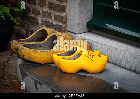 Two pairs of wooden shoes - klompen or clogs. Traditional dutch footwear Stock Photo