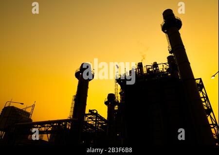 Petrochemical plant in silhouette image at sunset Stock Photo