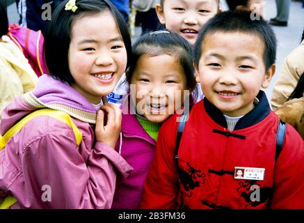 Chongqing China , March 2005 - Young Chinese students posing for a group photo at a school outing in Chongqing,China. Stock Photo