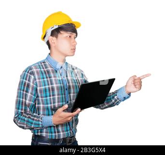 businessman. engineering confident using computer laptop and hand point wear yellow safety helmet plastic on white background. construction concept Stock Photo