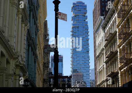 Historic cast-iron buildings in SoHo neighborhood with luxury high-rise 56 Leonard Street in Tribeca in the background.Lower Manhattan.New York City.USA Stock Photo