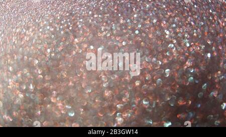 Blurred abstract photo of light burst and glitter golden bokeh lights. As Background. Stock Photo