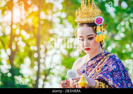 KANCHANABURI, THAILAND - APRIL 17 : Unidentified beautiful with traditionally dressed woman is crowned to be 'Miss Songkran' in parade on Songkran Fes Stock Photo