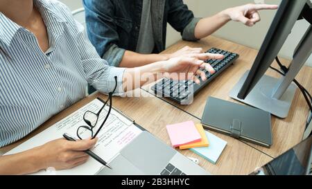 Collaborative work Software engineers website developer technologies or programmer working coding on startup ai application project on screen with par Stock Photo