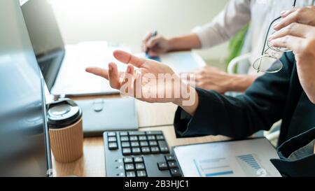 Business team investment Entrepreneur Trading discussing and analysis graph stock market in traders office. Business financial exchange concept. Stock Photo