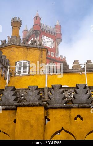 Sintra, Portugal - January 18, 2020: Blue sky attempts to break through the fog at the Pena Palace on a winter day Stock Photo