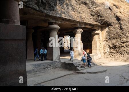 Mumbai, India - March 1, 2020: Tourists explore the ancient ruins and carvings of Elephanta Caves Stock Photo