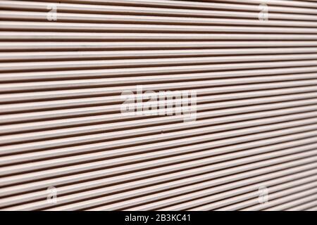 Abstract close-up of a modern wall surrounding a garden of a house as a background. Seen in Germany in February Stock Photo