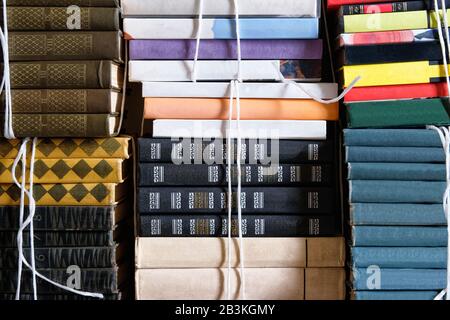 Book stack of step to success concept, closeup. Vintage books with empty labels with free copy space. Stock Photo
